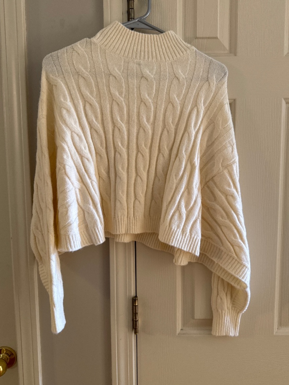 Cropped cable sweater